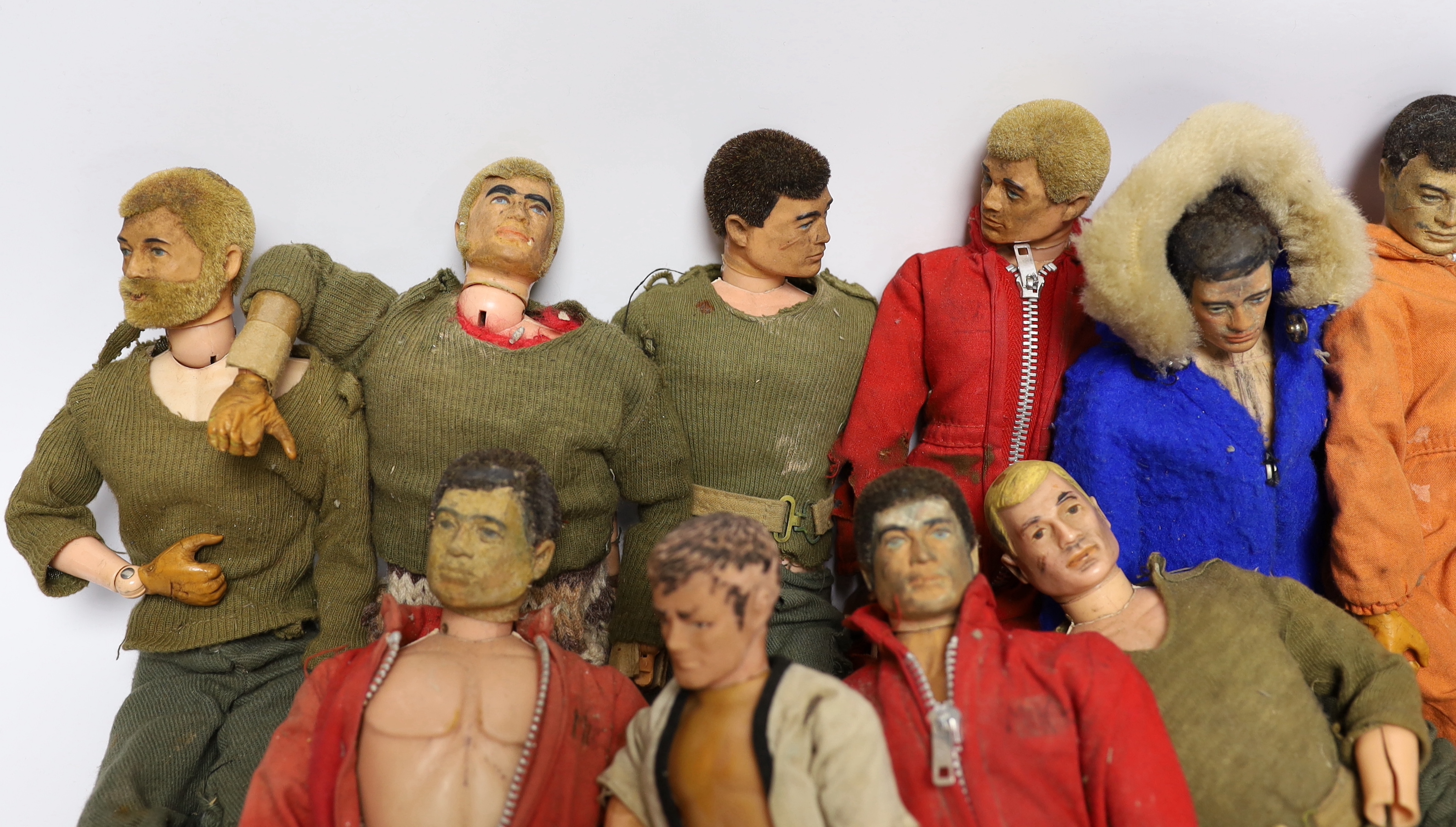 Nine 1960s/70s Action Man figures together with clothes and some accessories (a.f.)